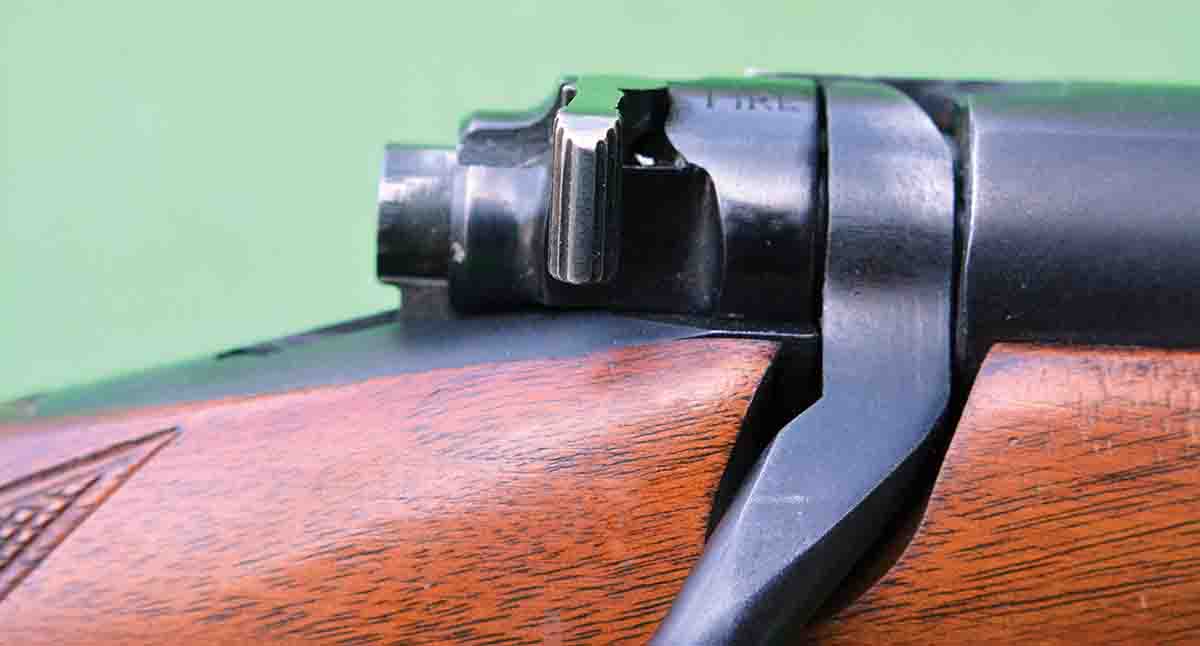 When the safety is placed in the middle position, it still locks the firing pin, but allows the bolt to be opened and the cartridge in the chamber can be safely removed.